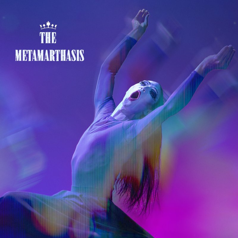 Figure with white face paint and open mouth, arms raised against a blurred purple and blue background. Long dark hair. Title text "The Metamarthasis" in white at top left.