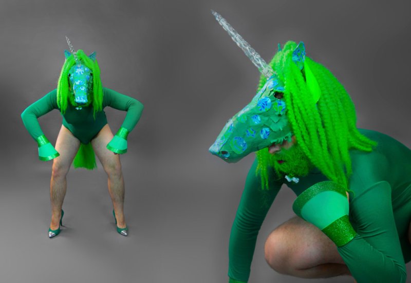 Two views of a person in a green unicorn costume with bright green hair and blue spots on a gray background.