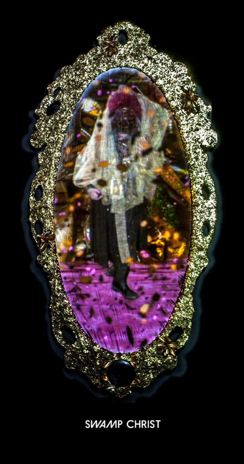 Artwork in ornate gold frame. Figure in white lace and dark clothing stands on a purple surface. Gold and pink confetti-like elements scattered throughout the scene.