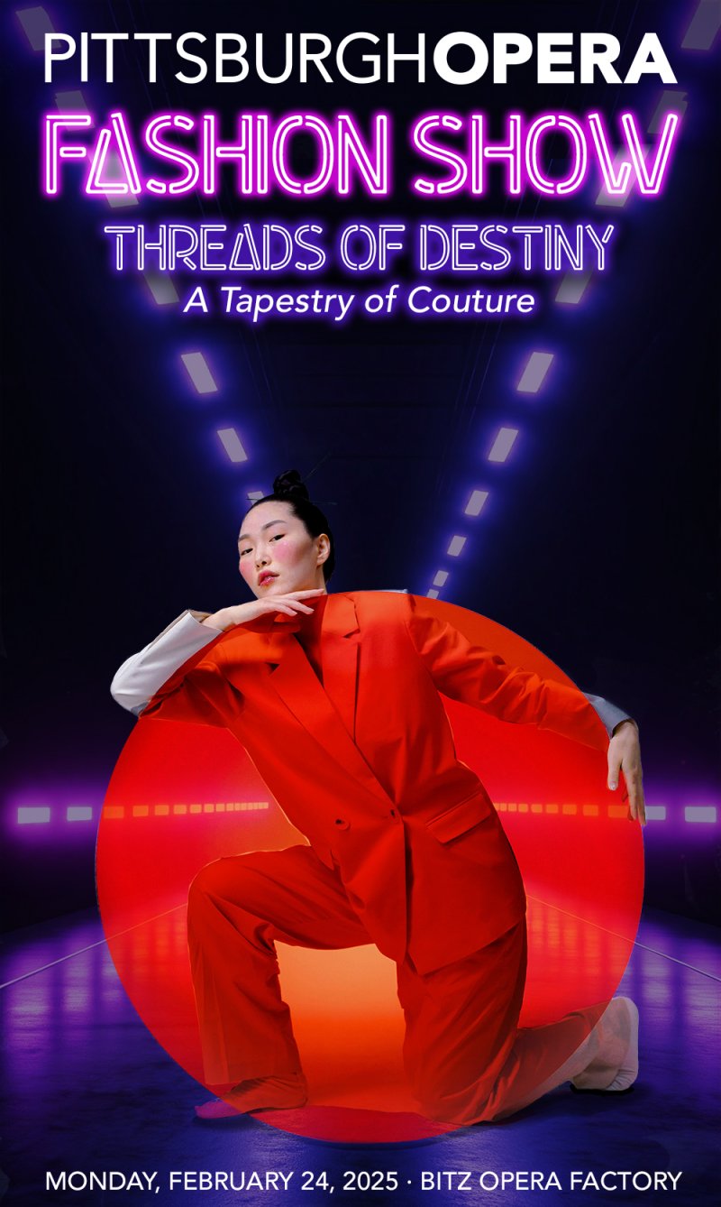 Fashion show poster with a model in an orange suit kneeling in a red circle, under glowing neon text and purple stage lights.