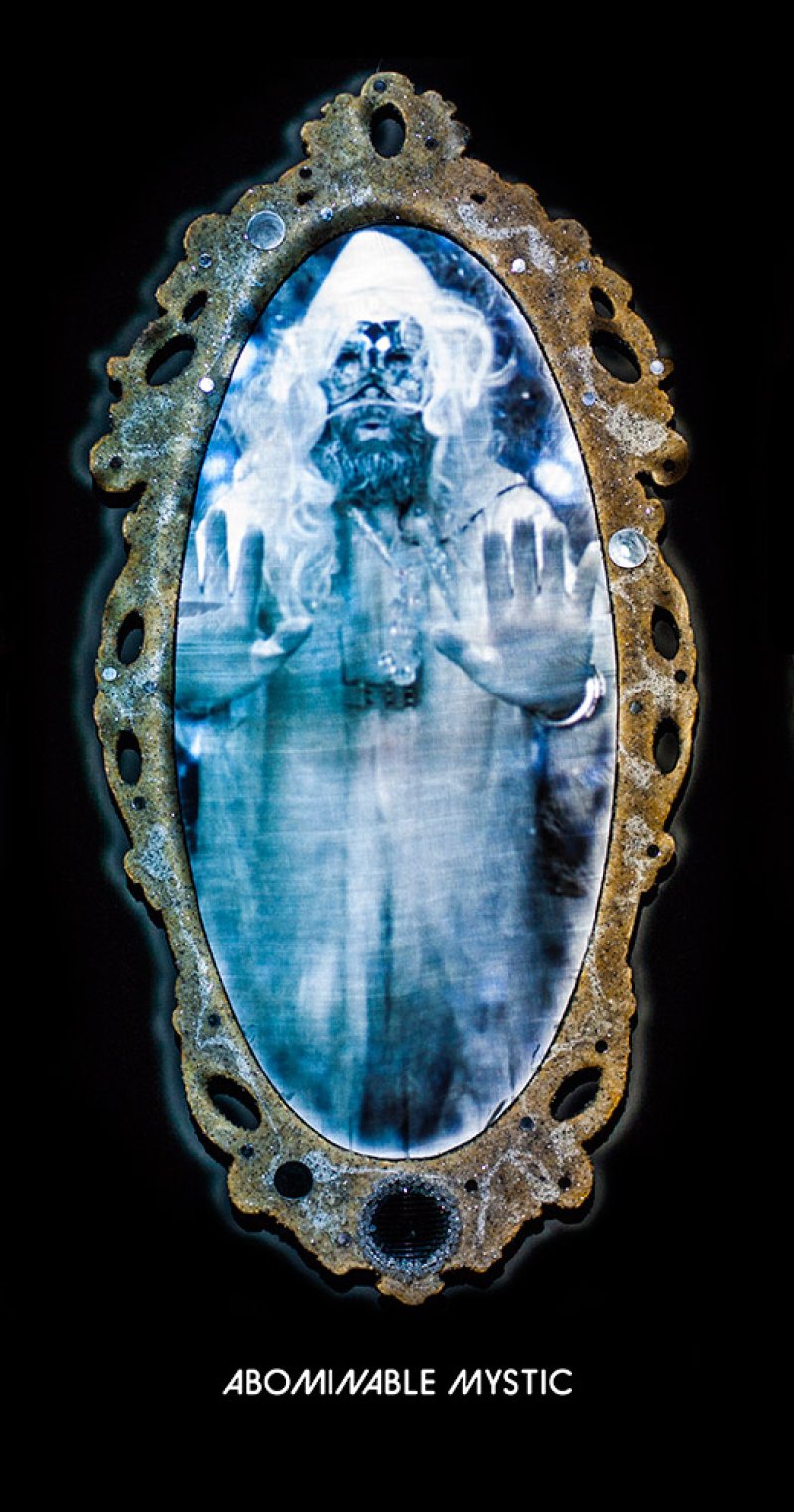 Ornate gold mirror reflecting a blue-toned figure with long white hair, beard, and outstretched hands.