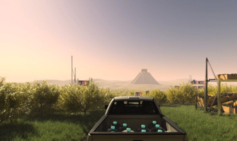 A pickup truck with blue objects in its bed faces a distant pyramid under a pale sky, surrounded by green fields and bushes.